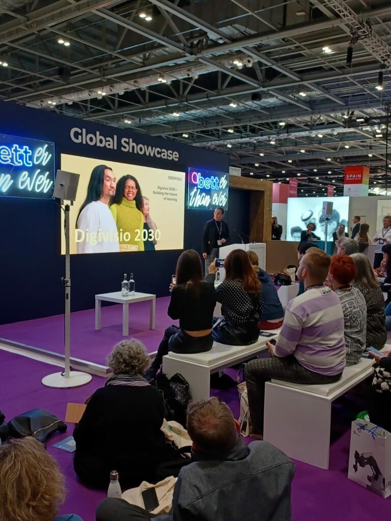 An event. People sitting and watching screen.