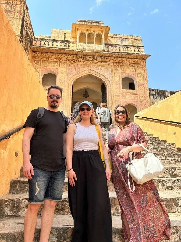 Juha Vierola, Sanni Saari and Sirpa Rutanen standing in front of the the famous Amber Palace in the city of Jaipur.