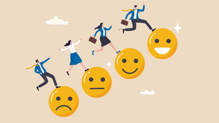 Piirretyt työntekijät hyppäävät surullisten ja iloisten hymynaamojen päällä.