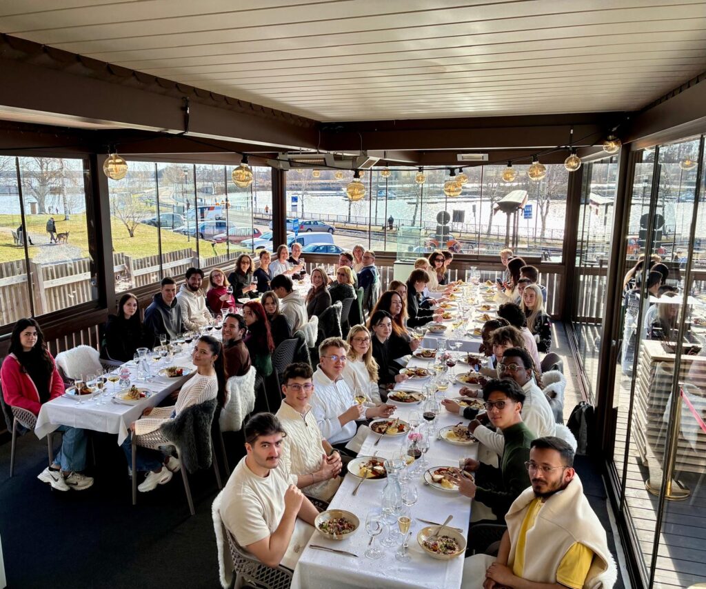 The whole group eating a dinner at Strampen.